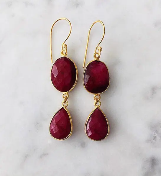anniversary gift guide image - ruby earrings with a marble background