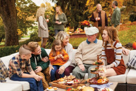 fall birthday party ideas image - family celebrating outside during the fall