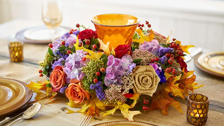 fall wreath image - fall wreath with candle holder in center on a table.