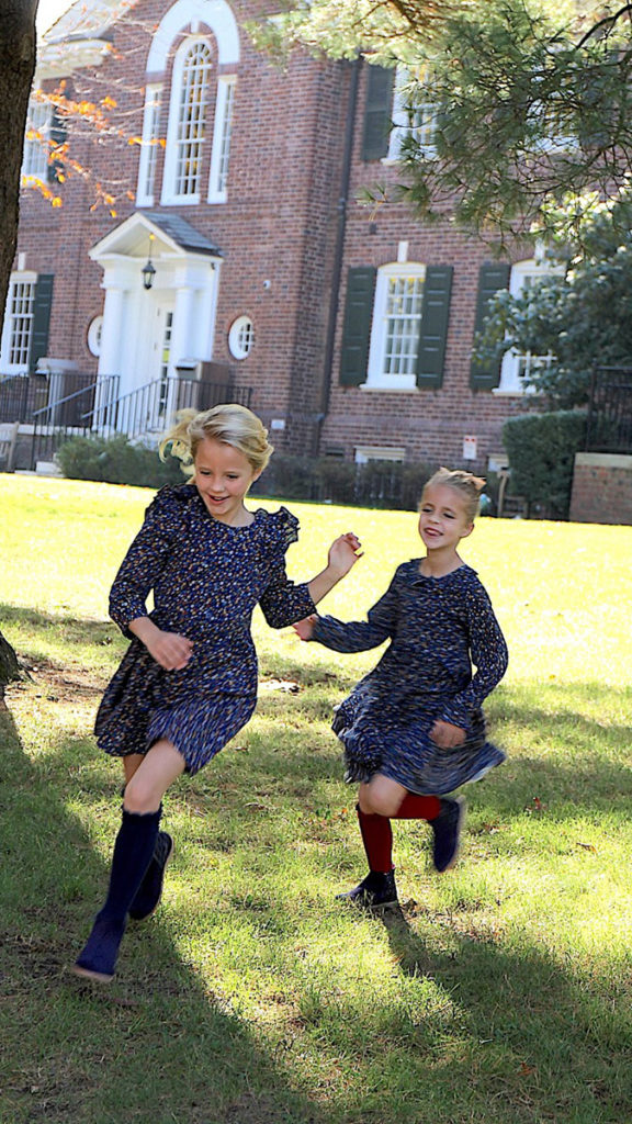 loving fall image -- girls chasing each other