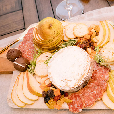 How to cut pears with a charcuterie board with pears, chocolate, and other snacks.