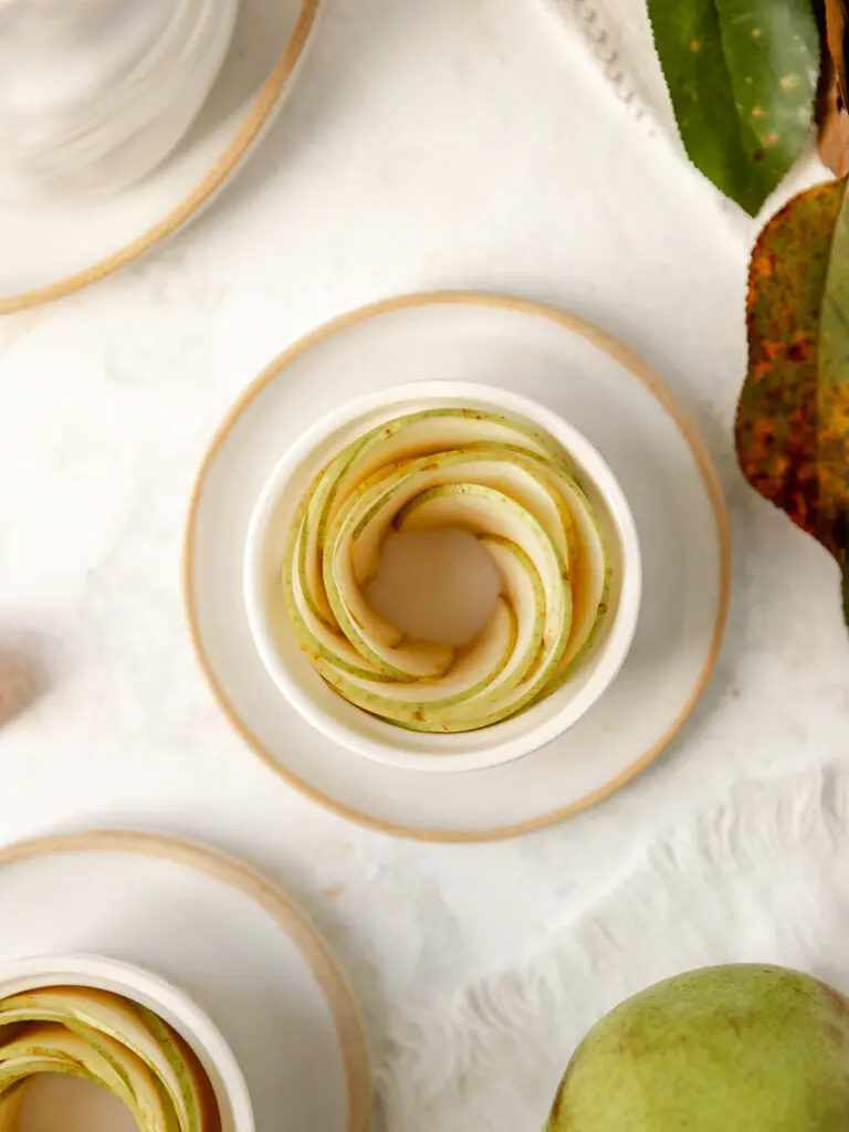 Sliced pears in a ramekin.