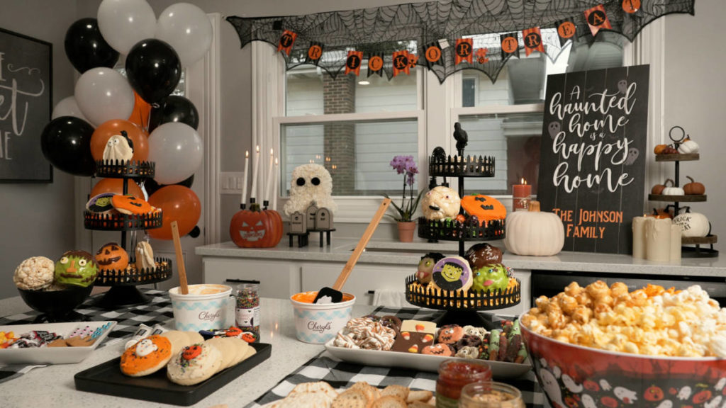 Halloween charades charcuterie spread with balloons