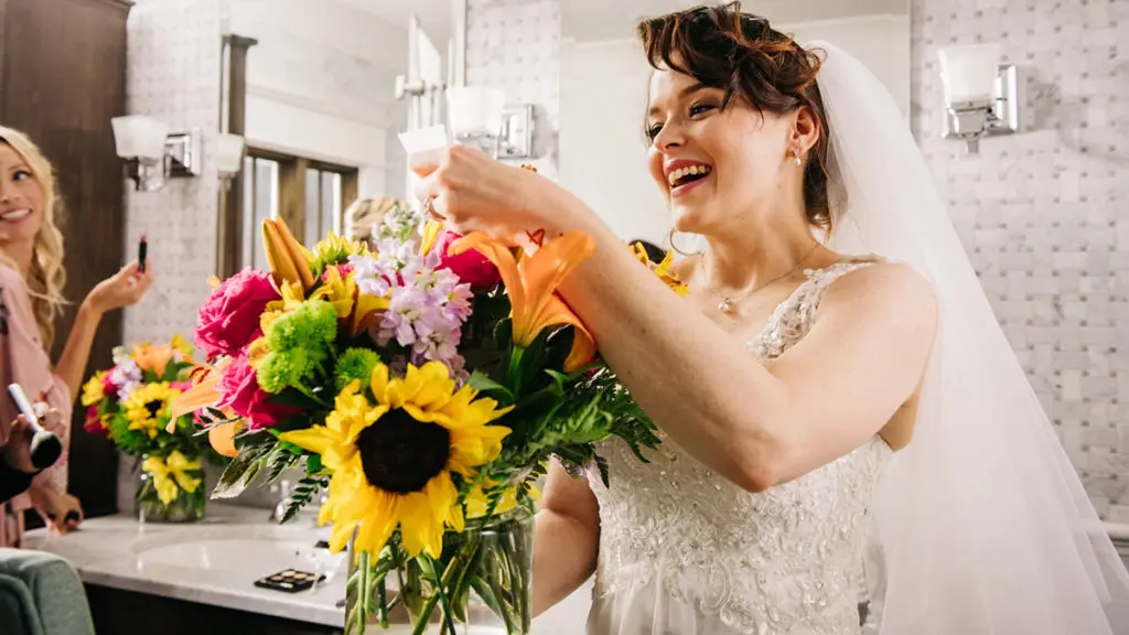 A photo of history of marriage with a bride looking at her bouquet