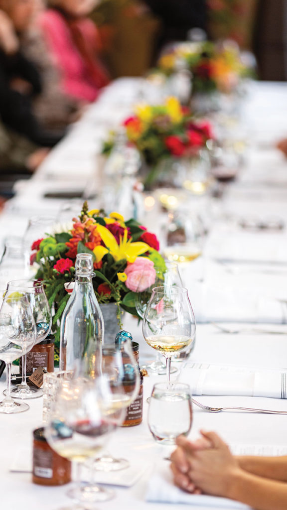 A photo of history of marriage with a wedding tablescape with colorful flowers