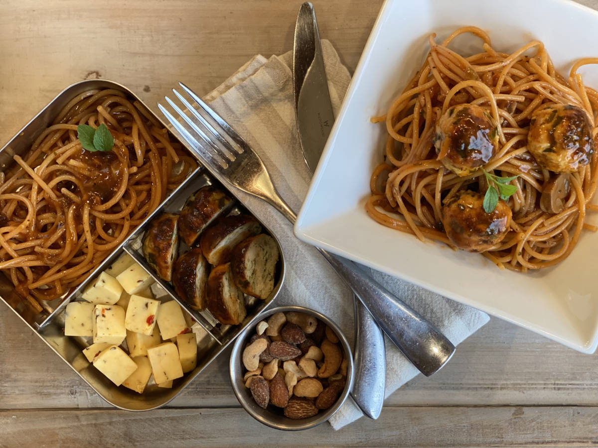 A photo of lunch box ideas, a lunch box with turkey meatballs next to a bowl of turkey meatballs