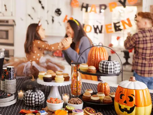 October birthday with a couple setting up for Halloween.