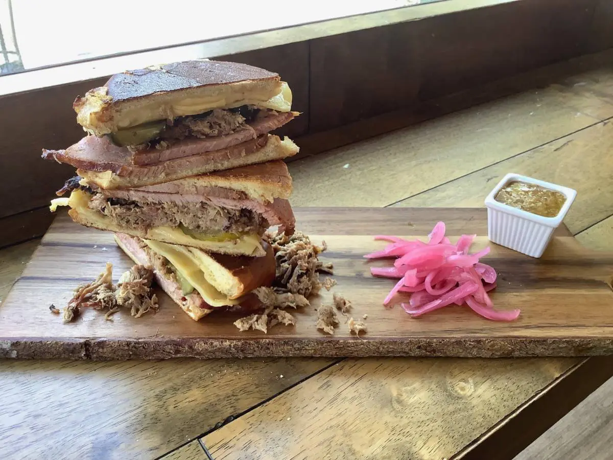 A photo of tailgating at home; Cuban sandwich