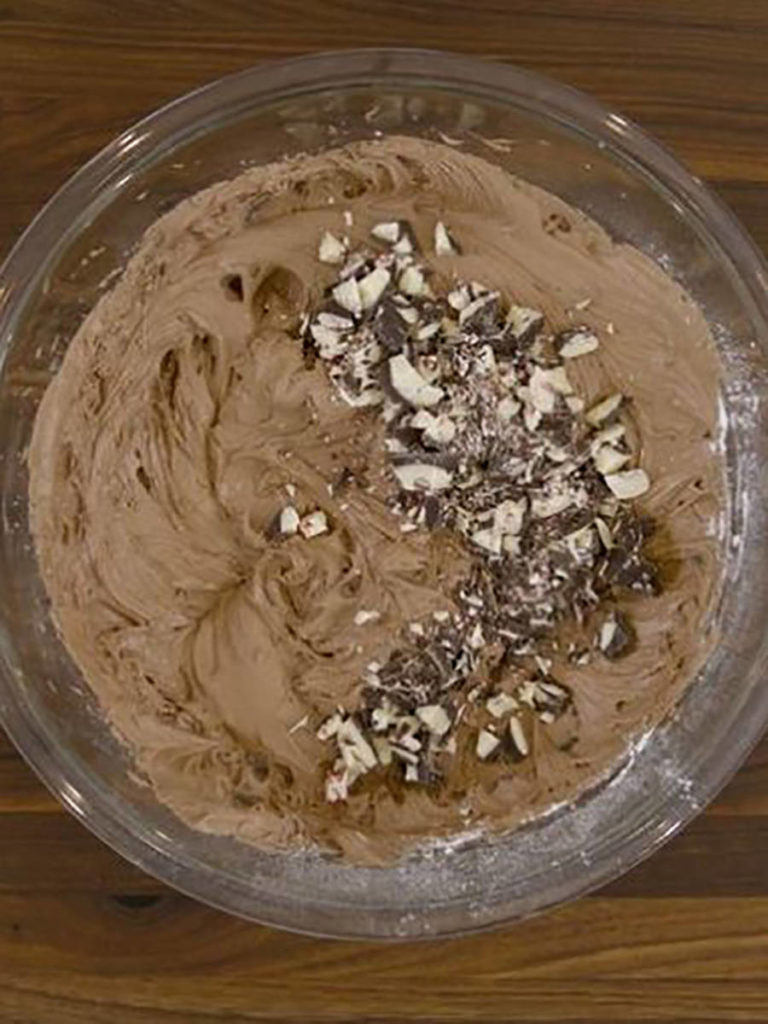 A photo of peppermint bark brownies mix in a bowl