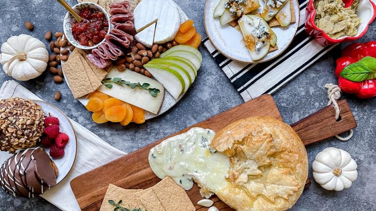 A photo of a Thanksgiving charcuterie board with cheese, meat, and fruit