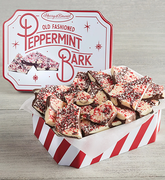 Christmas gift guide with a tin of peppermint bark.