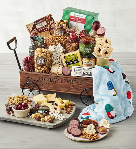 Christmas gift guide with a small wagon of sweet and savory treats.