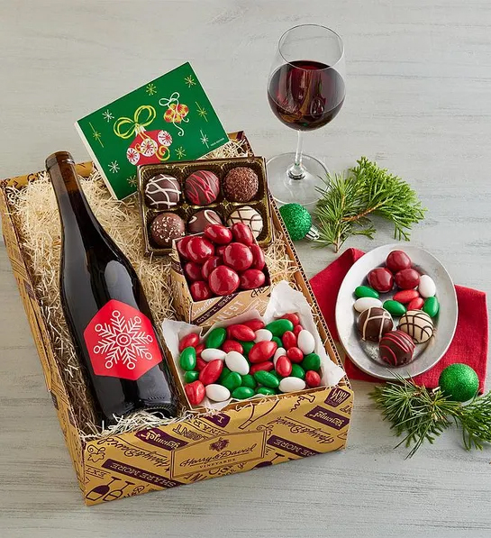 Regalos de Navidad para él con una caja de vino, bombones y almendras.