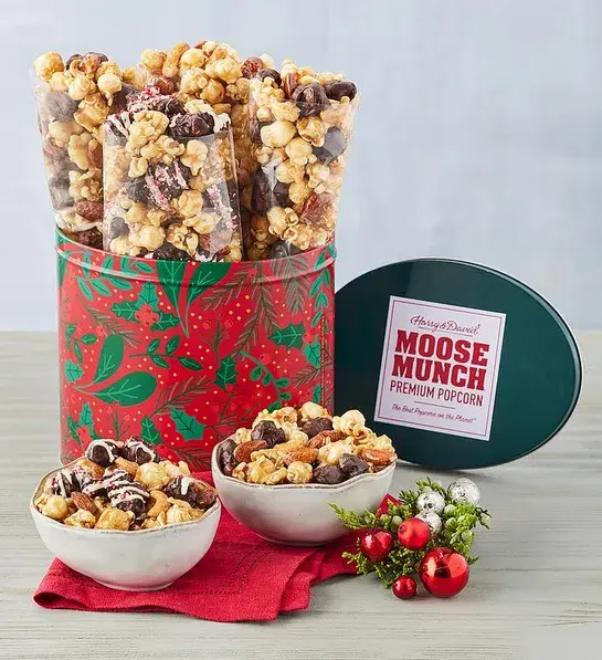 Gifts under $30 with a Christmas decorated tin full of Moose Munch popcorn.