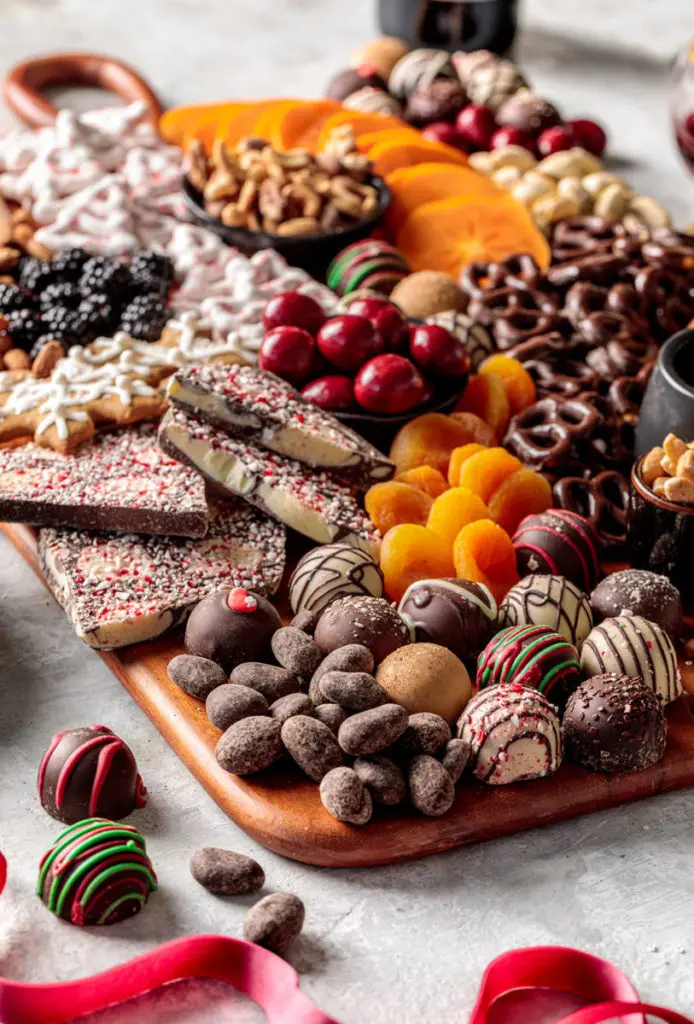 Holiday dessert board with cookies, chocolate, dried fruit and nuts
