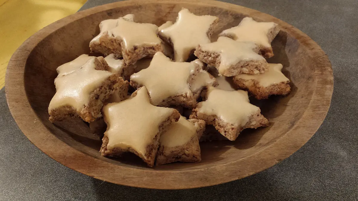 A photo of loving the holidays with a bowl of star shaped cookies.