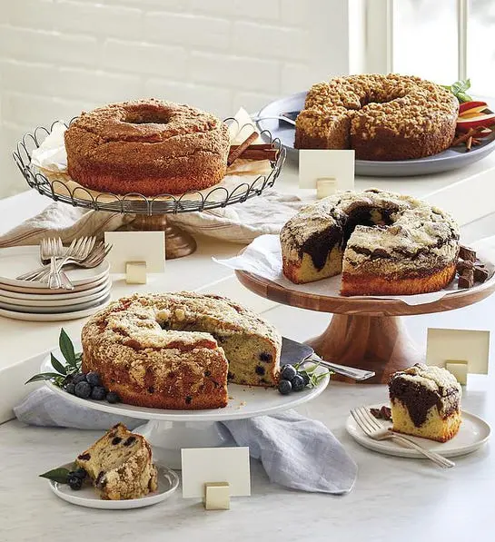 A photo of thanksgiving host gifts with four bundt cakes on cake stands