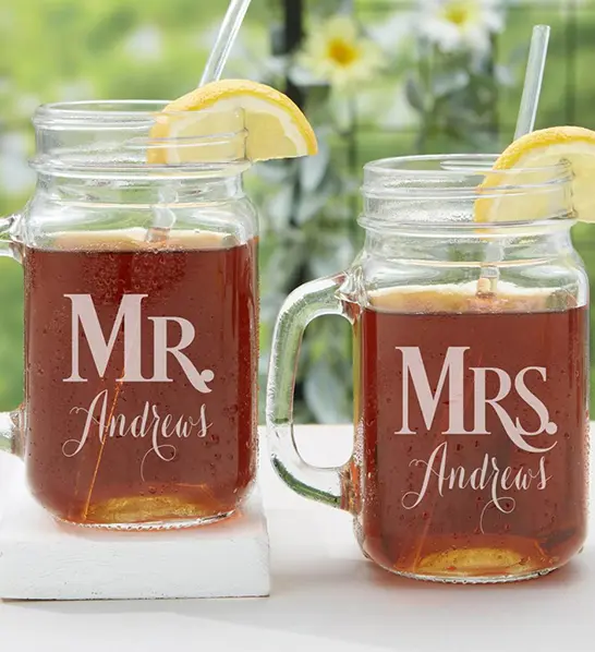 A photo of thanksgiving host gifts with two personalized beer mugs full of beer and a straw