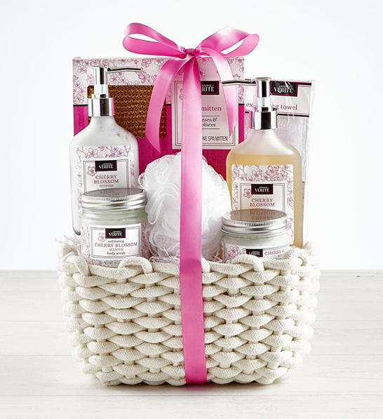 A photo of holiday gifts for employees with a basket of spa items.