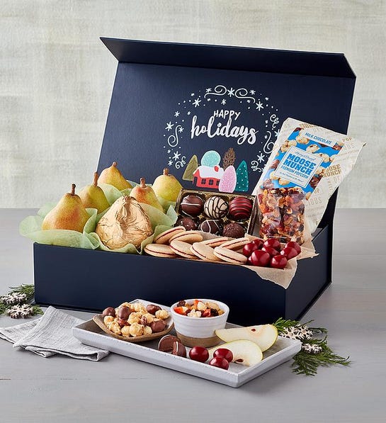 A photo of last-minute gift ideas with a box full of fruit, nuts, chocolate and other snacks