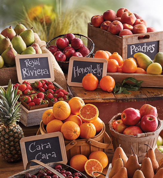 A photo of last minute gifts with an array of fruit in baskets and boxes.