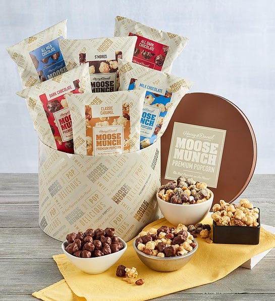 A photo of last minute gifts with a tin of Moose Munch and four bowls full of Moose Munch in front of the tin.