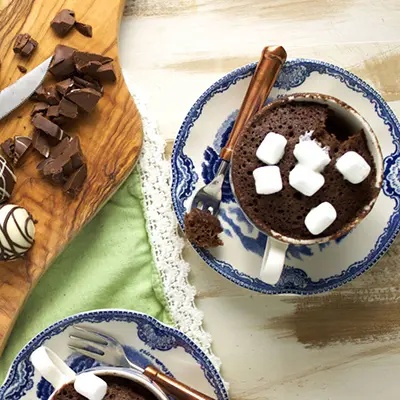 Chocolate truffle mug cake topped with marshmallows.