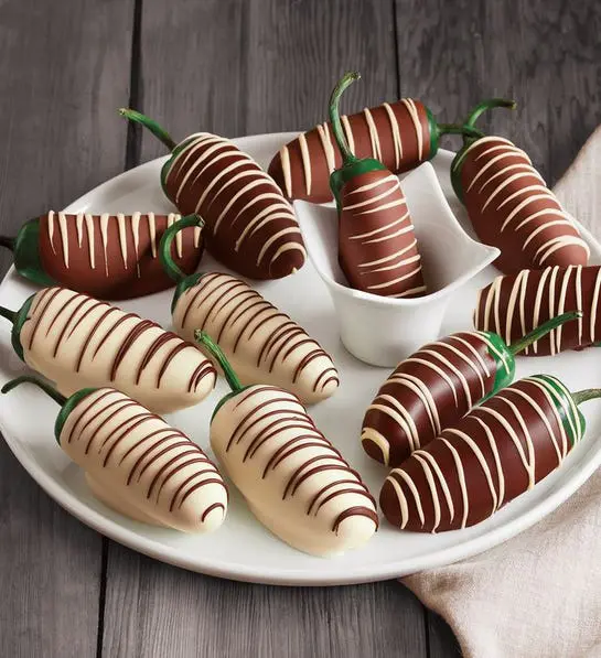 A photo of romantic foods with chocolate-covered jalapenos on a platter.