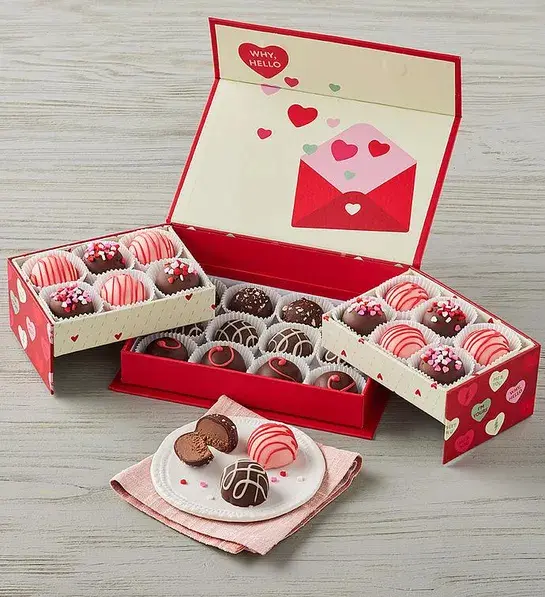 Valentine's Day gifts for her with a box folding box of truffles decorated for Valentine's Day.