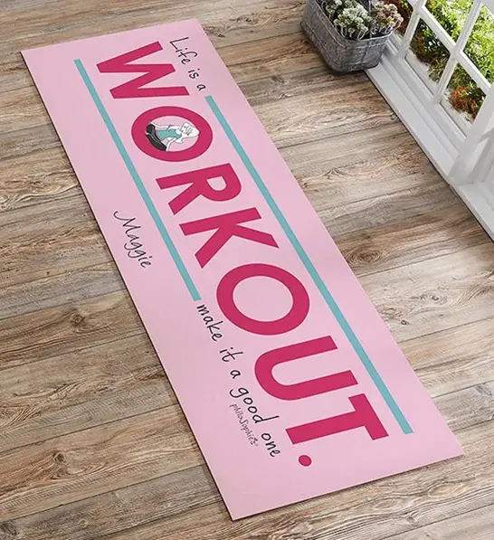 A photo of gifts for women with a personalized pink yoga mat.