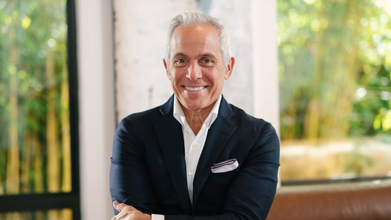A photo of Geoffrey Zakarian smiling at the camera