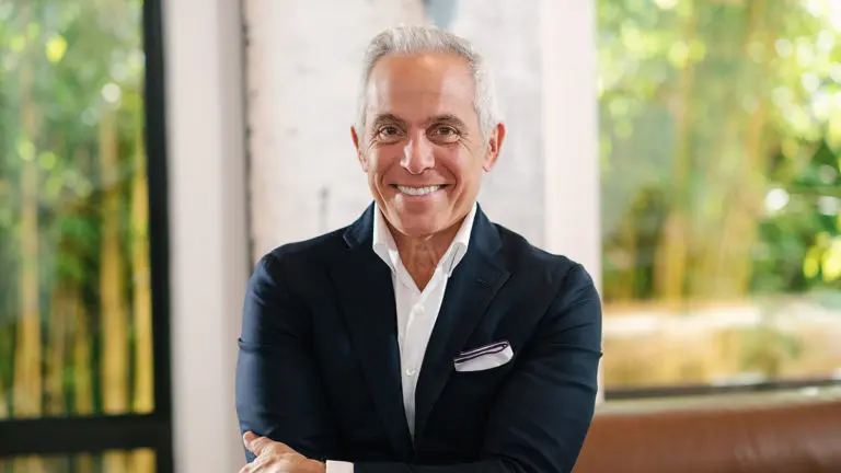 A photo of Geoffrey Zakarian smiling at the camera