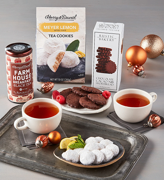 Selection of tea cookies around two cups of tea.