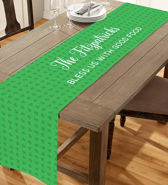 A photo of St. Patrick's Day celebrations with a personalized green table runner on a wooden table.