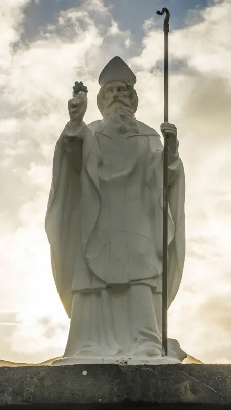 A photo of St. Patrick's Day with a statue of St. Patrick in Ireland.