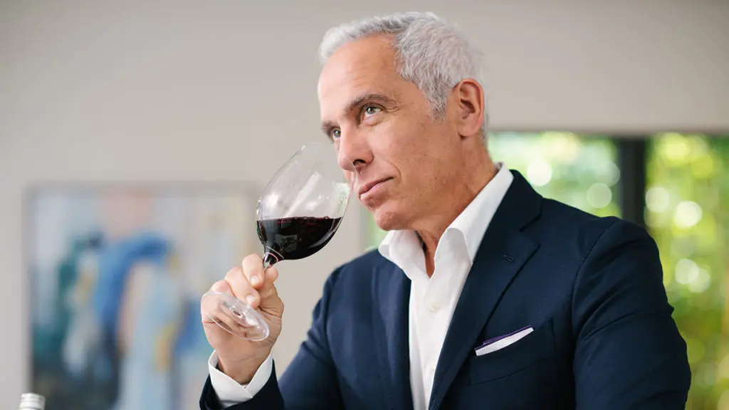 A photo of Chef Zakarian drinking a glass of wine