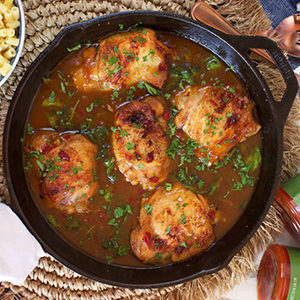 A photo of chicken recipes with a skillet full of chicken and relish