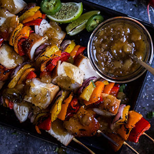 A photo of chicken recipes with a plate of chicken skewers