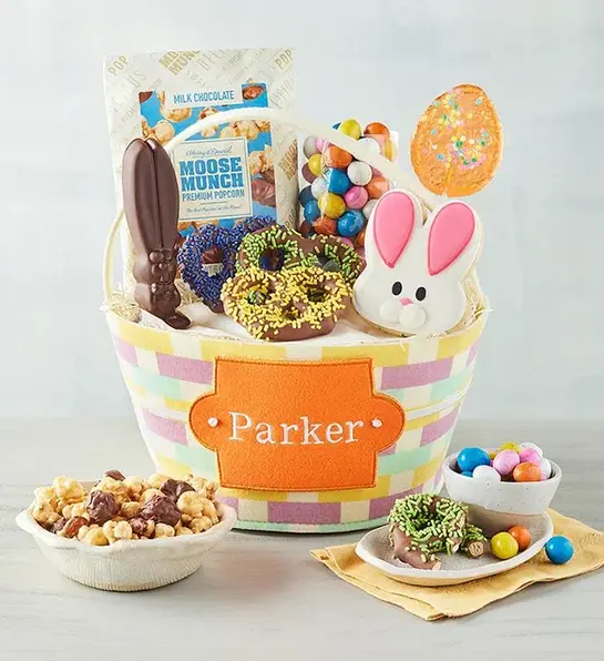Easter gift ideas with a personalized gift basket full of candy and Easter chocolate.