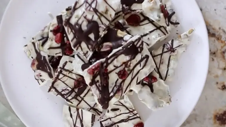 A photo of white chocolate with a plate of white chocolate bark on a plate