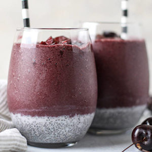 A photo of breakfast recipes with two chia cherry smoothies