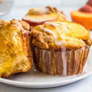 A photo of breakfast recipes with a plate of peach muffins