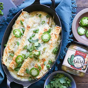 A photo of may recipes with a dish of enchiladas with salsa verde