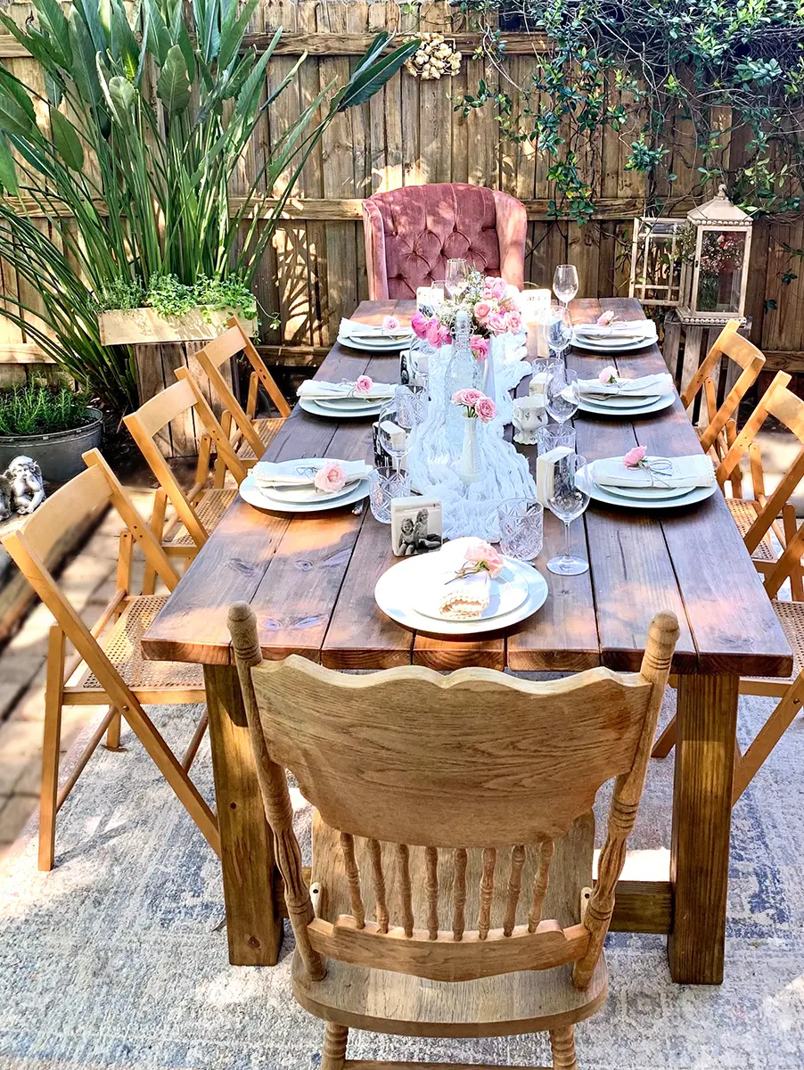 A photo of mother's day brunch recipes with a set table outside.