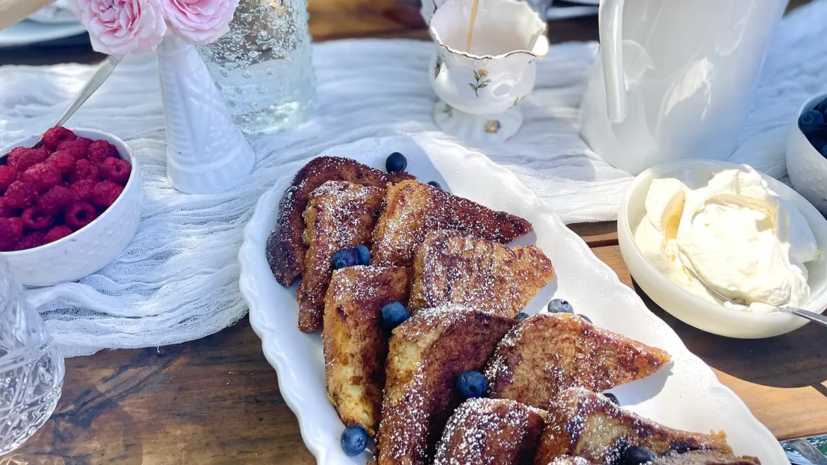 A photo of Mother's Day brunch recipes with a plate of French toast