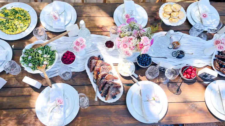 A photo of Mother's Day brunch recipes with a table laid with different brunch dishes