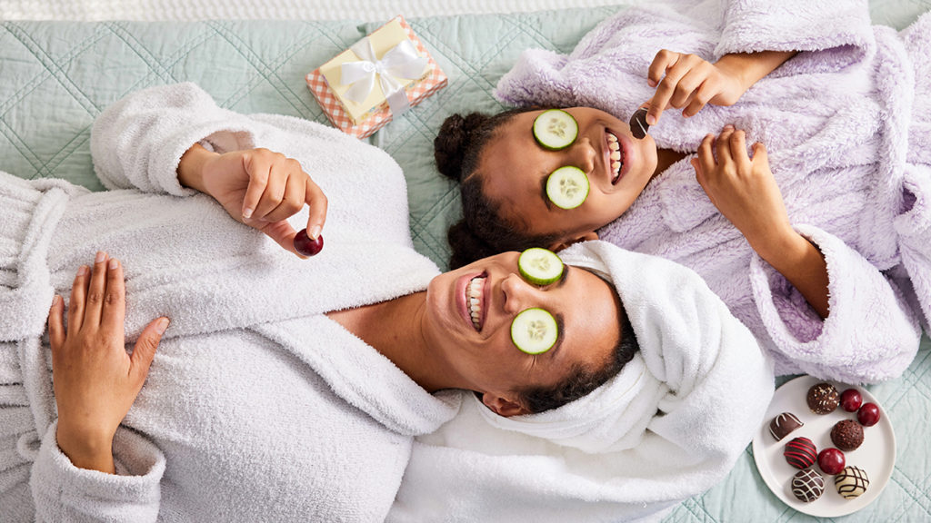A photo of mother's day ideas with a mother and daughter doing a spa day in robes