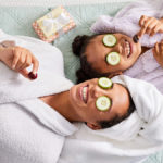 A photo of mother's day ideas with a mother and daughter doing a spa day in robes