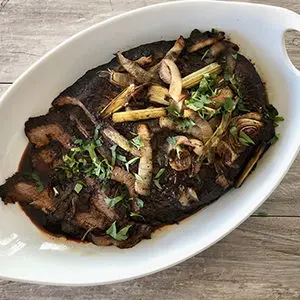 A photo of slow cooker recipes with a bowl of brisket