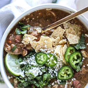 A photo of slow cooker recipes with a bowl of chicken chili
